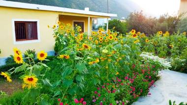 Flowery House near the Sea and the Mountain