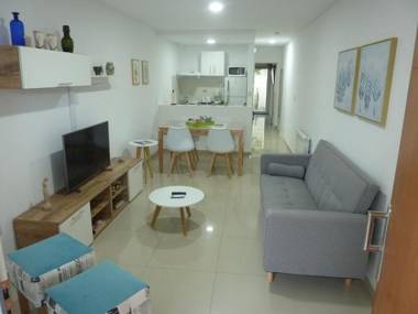 Edificio Nikemen moderno dpto con patio y cochera cubierta