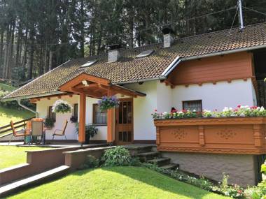 A pleasant detached house at the edge of a wood.