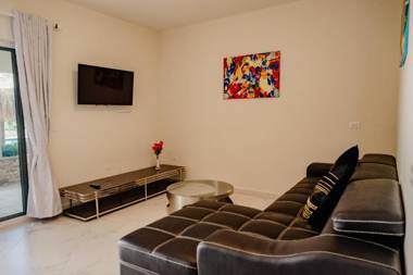 Fabulous modern 2-bedroom apartment with tropical garden pool and jacuzzi