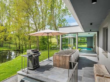 Modern villa with indoor swimming pool in the middle of the Noiseaux nature