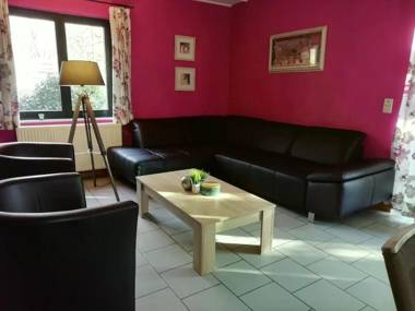 Rustic holiday home with sauna and jacuzzi in wooded area