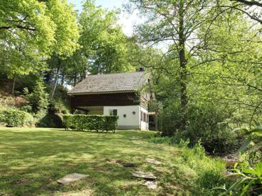 Detached cosy holiday home with sauna in a wooded area