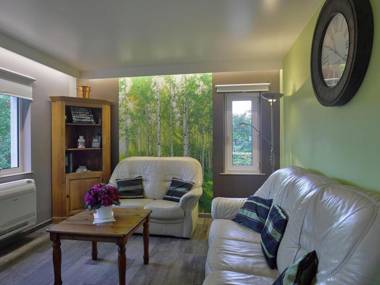 Detached cosy holiday home with sauna in a wooded area