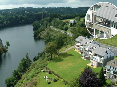 Luxury holiday apartment with a sauna fireplace and views over a lake