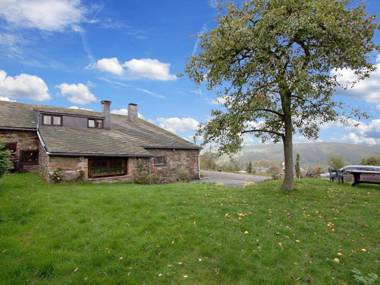 Semi-detached farm situated at the edge of the woods