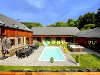 Beautiful villa with heated outdoor pool sauna and jacuzzi at a large forest