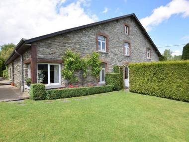 An old farmhouse in a peaceful Ardennes village on the edge of the forest