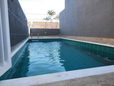 Casa nova frente a praia com três suítes