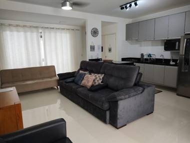 Casa nova frente a praia com três suítes