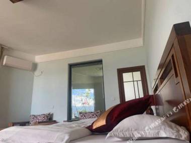 Da Li Shuang Lang Sha Niu Ban Dao Quan Jing Inn