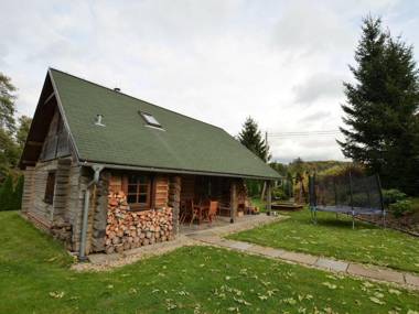 Detached log house with large fenced garden covered terrace