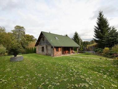 Detached log house with large fenced garden covered terrace