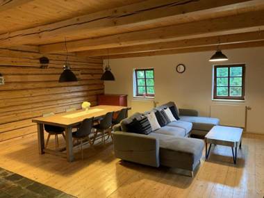 Detached log house with large fenced garden covered terrace