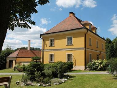 Lovely renovated former parsonage with a romantic enclosed courtyard in Western Bohemia.