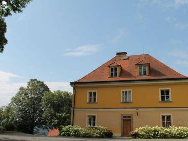 Lovely renovated former parsonage with a romantic enclosed courtyard in Western Bohemia.