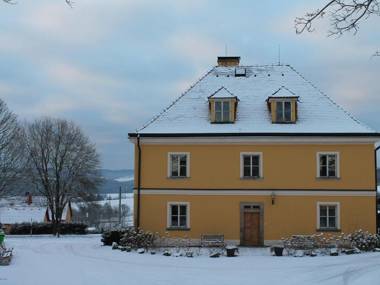 Lovely renovated former parsonage with a romantic enclosed courtyard in Western Bohemia.