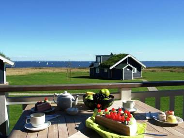 Modern detached bungalow with a fireplace on the Baltic Sea