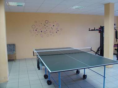 Detached wooden bungalow in a green wooded area