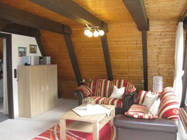 Wooden bungalow with a terrace in a wooded area