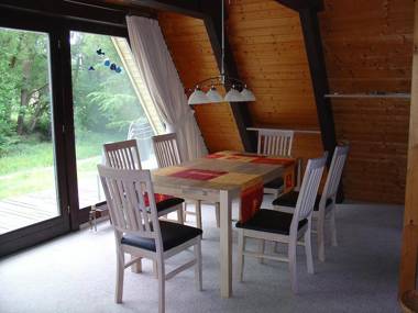 Wooden bungalow with a terrace in a wooded area