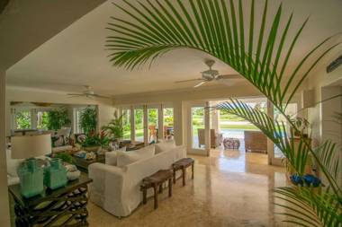 Luxury golf-front villa with golf cart close to the beach in exclusive resort