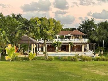 Golf and beach resort villa with beautiful sunsets pool golf cart and service staff