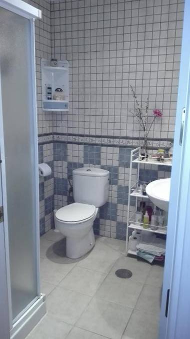 Bright apartment with bedroom living room and private bathroom by the sea.