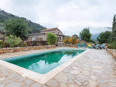 A beautifully restored farmhouse with a private pool in the mountains