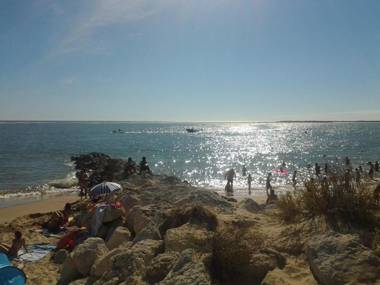 Small house between lake and sea