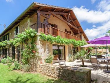 Spacious farmhouse with private heated pool in a rustic garden.