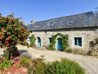 17th century Breton cottage with modern interior on the edge of a forest.