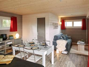 Modernly furnished cottage with beautiful terrace by a lake