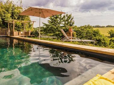 Spacious house on a hill with views and shared pool.