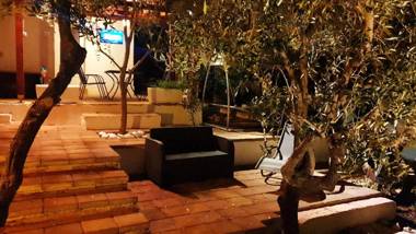 House with big walled oliva garden