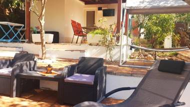 House with big walled oliva garden