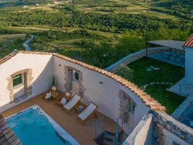 Holiday home with roof-pool sauna and garden in an idyllic location