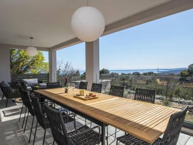 Villa with swimming pool outdoor kitchen sauna jacuzzi play area and sea view