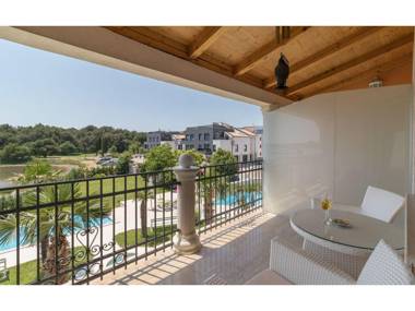 Modern apartment with balcony sea and pool view for a couple in Medulin