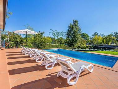 Beautiful villa with swimming pool surrounded by a natural fence