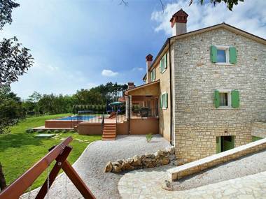 Beautiful villa with swimming pool surrounded by a natural fence