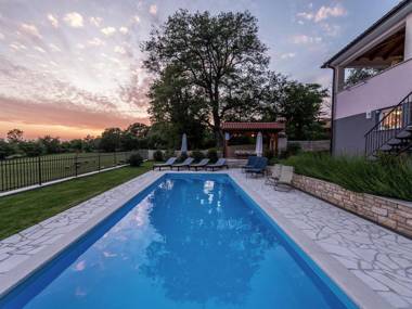 Modern and luxury house situated on a private plot with large garden and pool