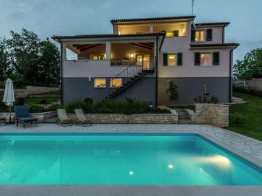 Modern and luxury house situated on a private plot with large garden and pool
