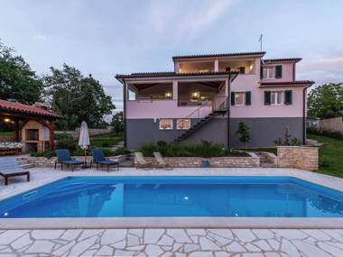Modern and luxury house situated on a private plot with large garden and pool