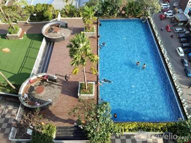 WarmHomey Studio at Vida View Makassar By Travelio