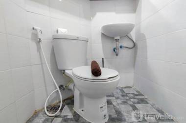 Comfort 1BR at Amartha View Apartment By Travelio