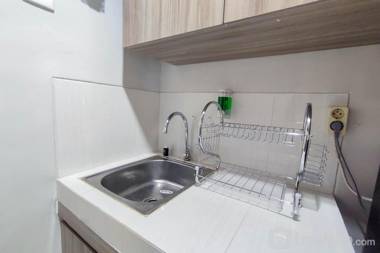 Comfort 1BR at Amartha View Apartment By Travelio