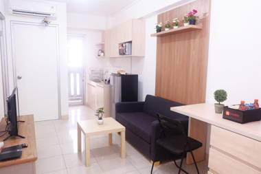 Cozy 2BR Baywalk Green Bay Apartment By Travelio