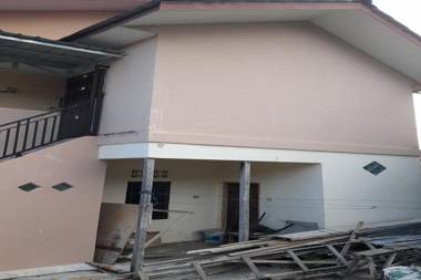 SPOT ON 91616 Kharisma Guest House