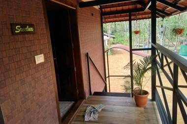 Sansree's Puzhakkal Riverview Cottage